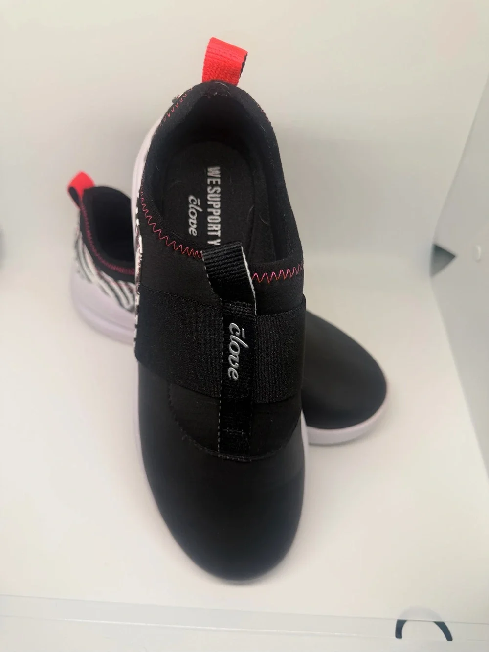 clove Women's Black Slip-On Sneakers with Neon Pink Accents